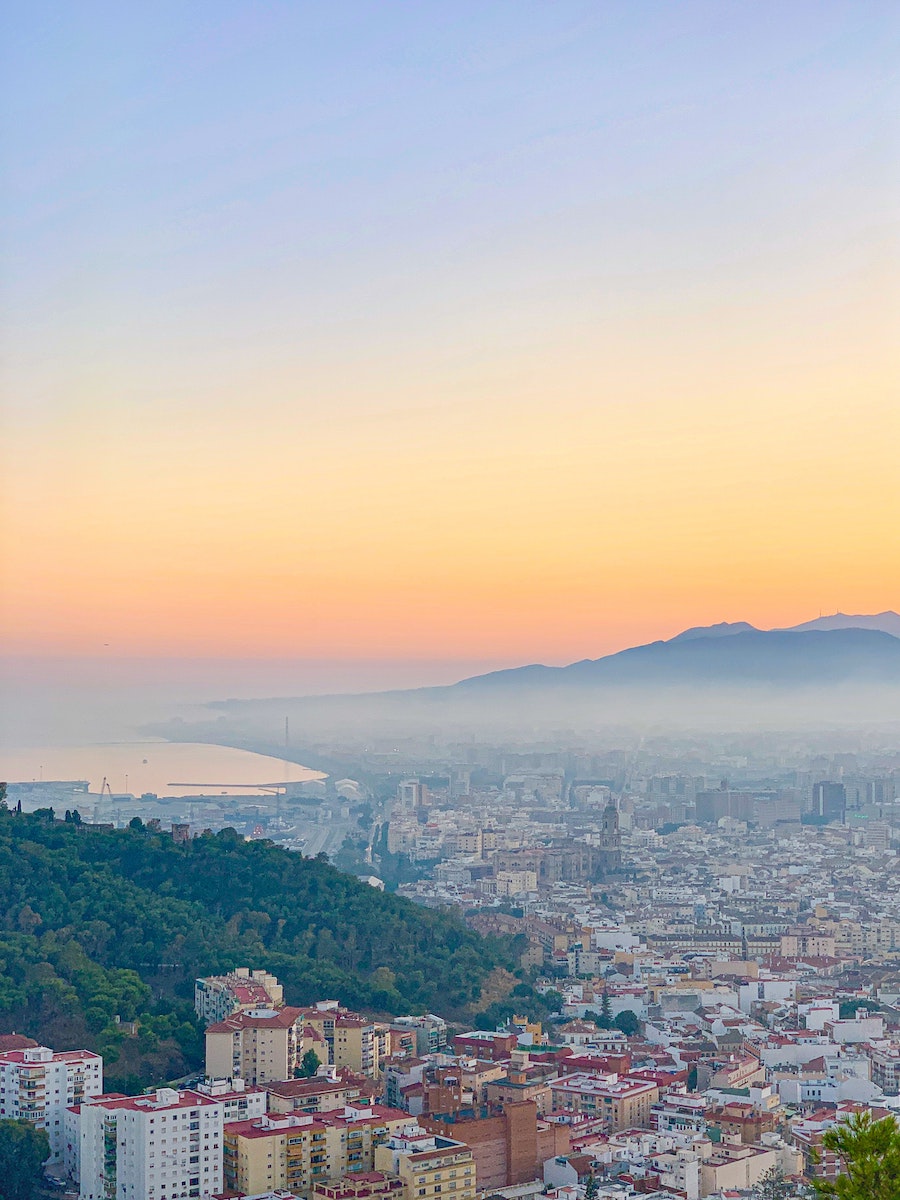 Cover picture of Malaga city skyline at sunset